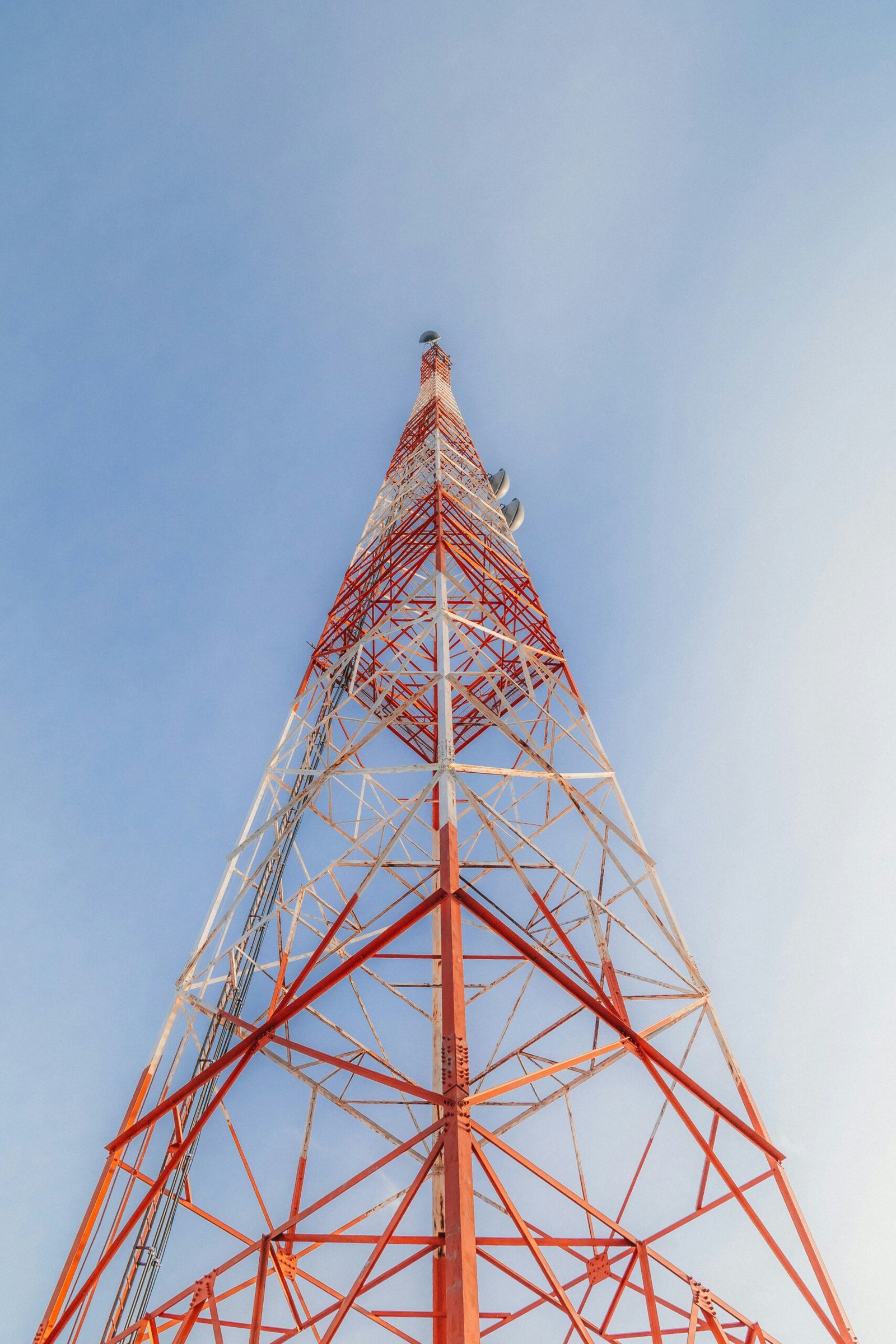 a tall red tower with a sky in the background